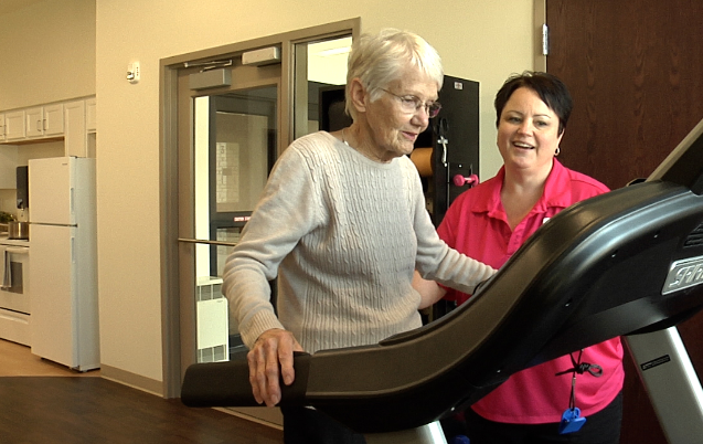 Old women using treadmill